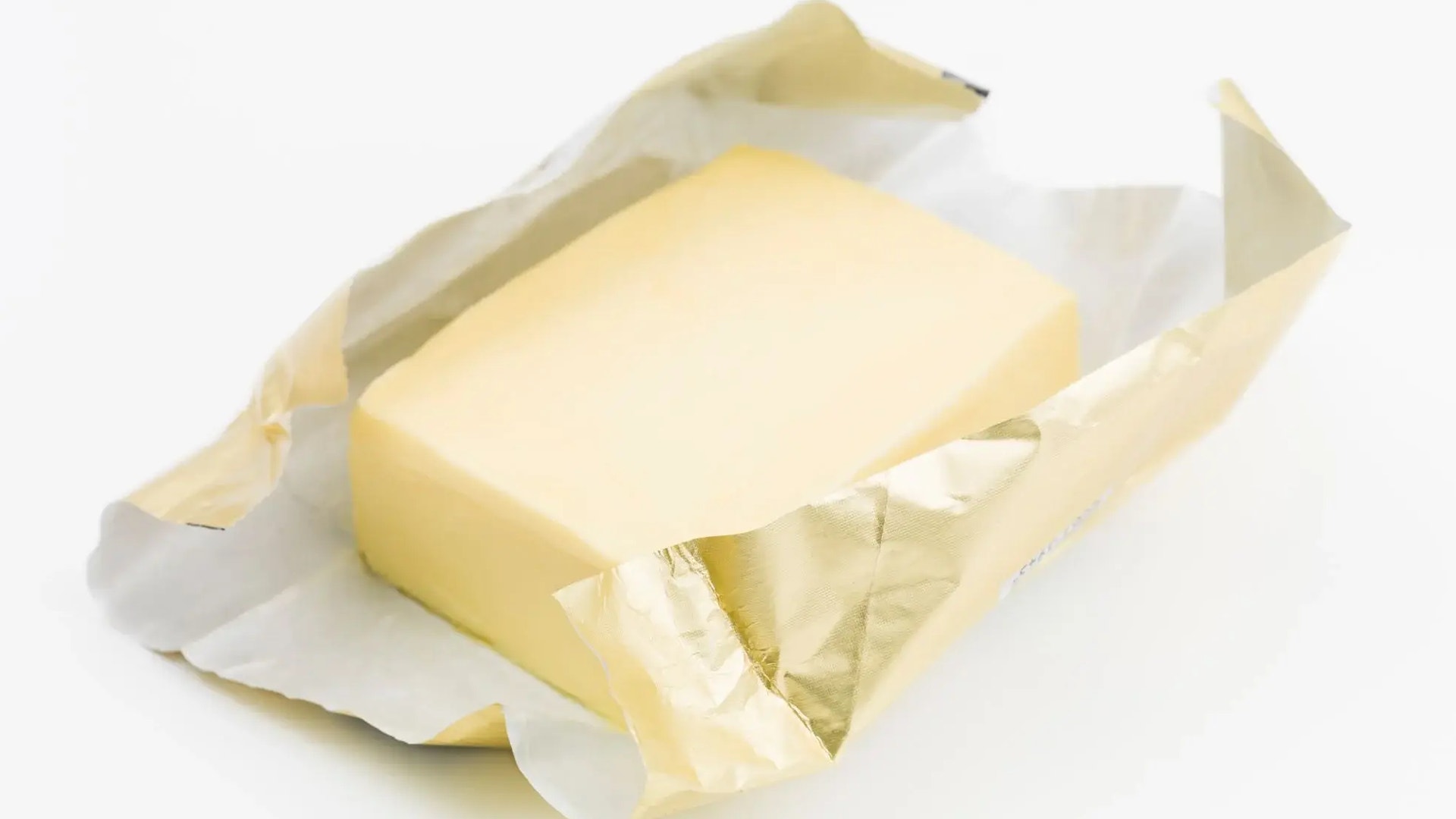 Smörpaket med gul smörstick i vitt omslag